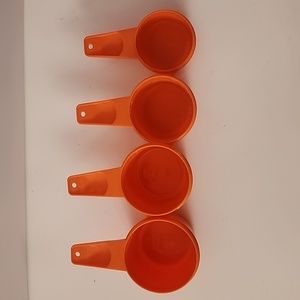 Set of 4 Tupperware Measuring Cups.